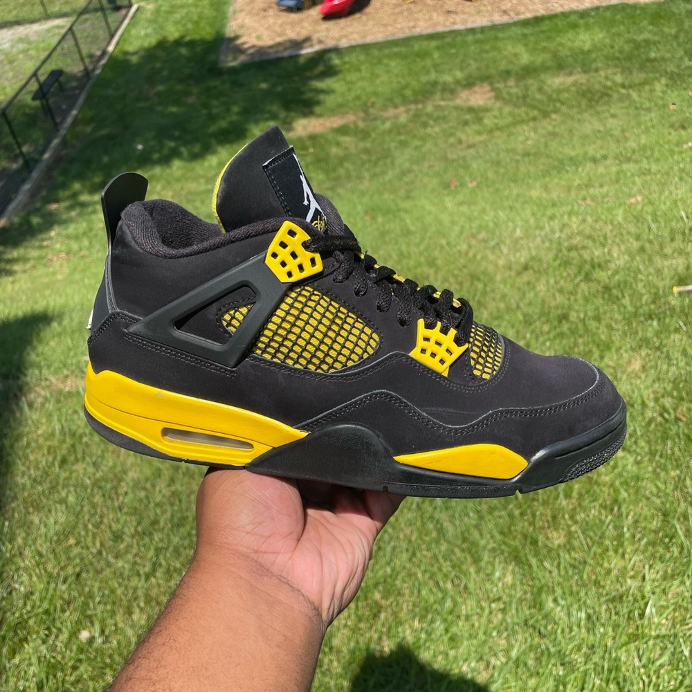 Jordan 4 Retro “Thunder” size 11 Pre owned condition with original box.